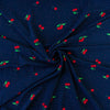 Have some fun with our navy and pink polka dot designer deadstock fabric by the yard adorned with vibrant red cherries. Made from high-quality polyester crepe, this fabric has a textured hand, lovely drape, and a vintage vibe. Image of fabric body.