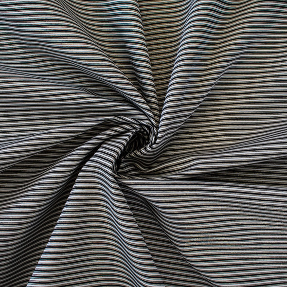 gorgeous silk ottoman suiting fabric by the yard. Featuring classic black and white horizontal stripe, enhanced by the subtle shimmer of gold metallic threads. Perfect for creating a formal gown, suiting, or a lovely lightweight coat to pair with that little black dress! Image of fabric body.