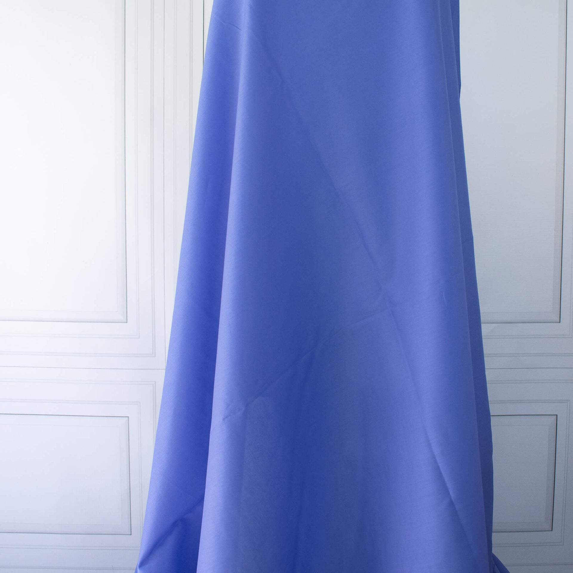 Draped blue cotton lawn designer fabric.