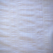 Close-up of white dimity designer fabric with a textured pattern