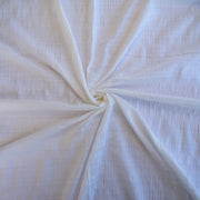 Close-up of white fabric with a textured pattern