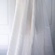 Designer white dimity  fabric draped on dressform