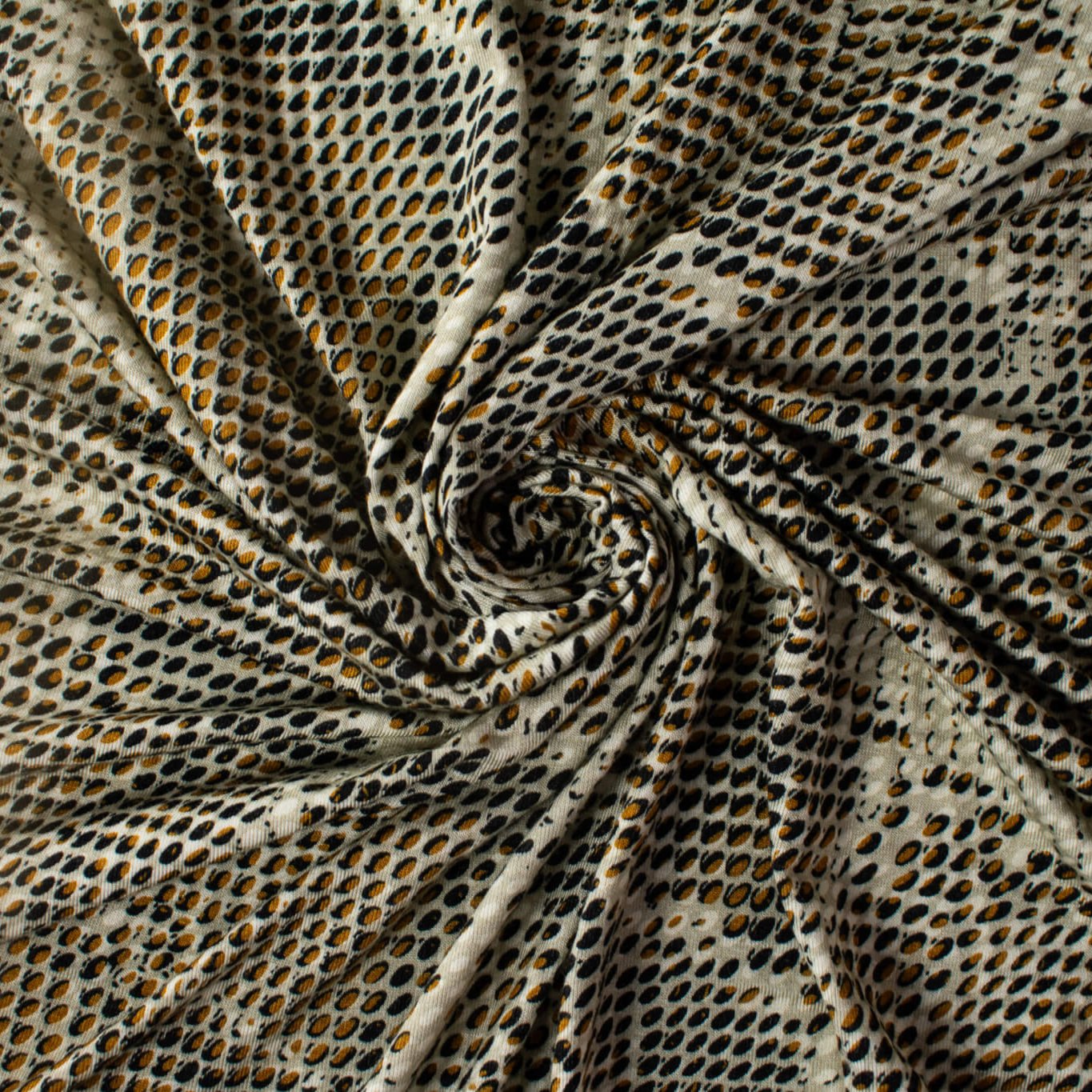 Italian Geometric Animal Print knit fabric by the yard directly from Ratti, the renowned mills know for its excellence in textiles. The elegant shades of browns and tans make it perfect for a sophisticated knit top or as a versatile choice for the latest designer wrap dress. Image of fabric fullness.