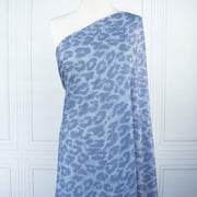 French Animal Print Fine Knit Crepe fabric by the yard in shades of blue. Liven up your next project with a gorgeous animal print that pairs well with navy, gray, purple and white. This translucent fine crepe has a lightly textured hand, a bit of stretch, and a lovely graceful drape.  Image of fabric on dressform.