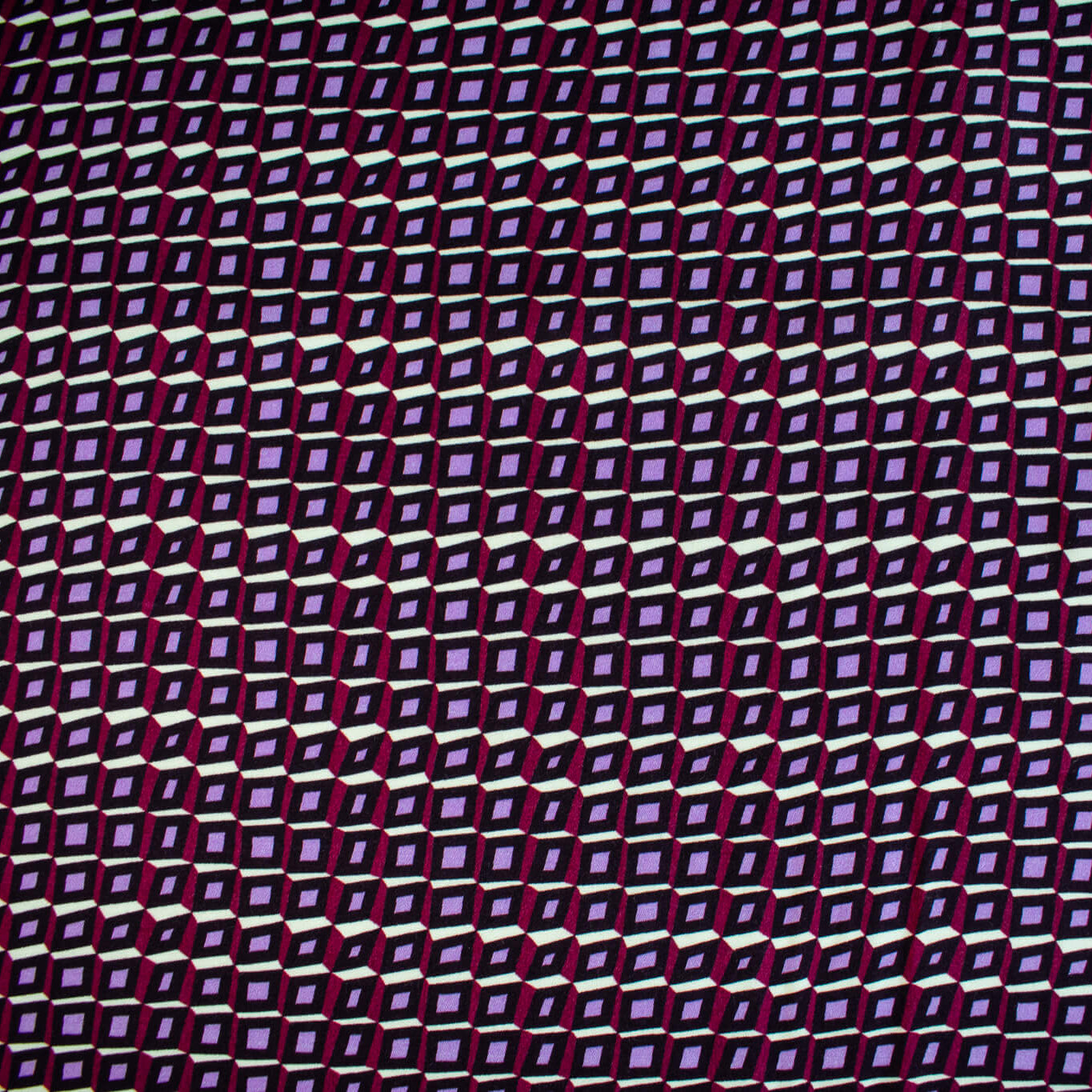 Image of fabric design. Italian Viscose Satin Modern Geometric Print designer deadstock fabric by the yard. From the Italian mills, enjoy a sophisticated geometric print of small squares in shades of purple highlighted by an ivory background. A cool smooth hand and satiny sheen is perfect for creating a top or dress that can take you from day to evening.