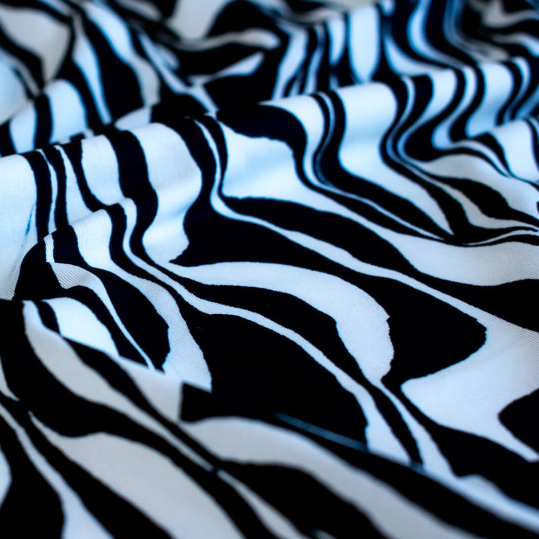 Close up Black and Ivory Italian ITY jersey knit fabric by the yard 