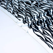 Close up selvedge  of Black and Ivory Italian ITY jersey knit fabric by the yard 