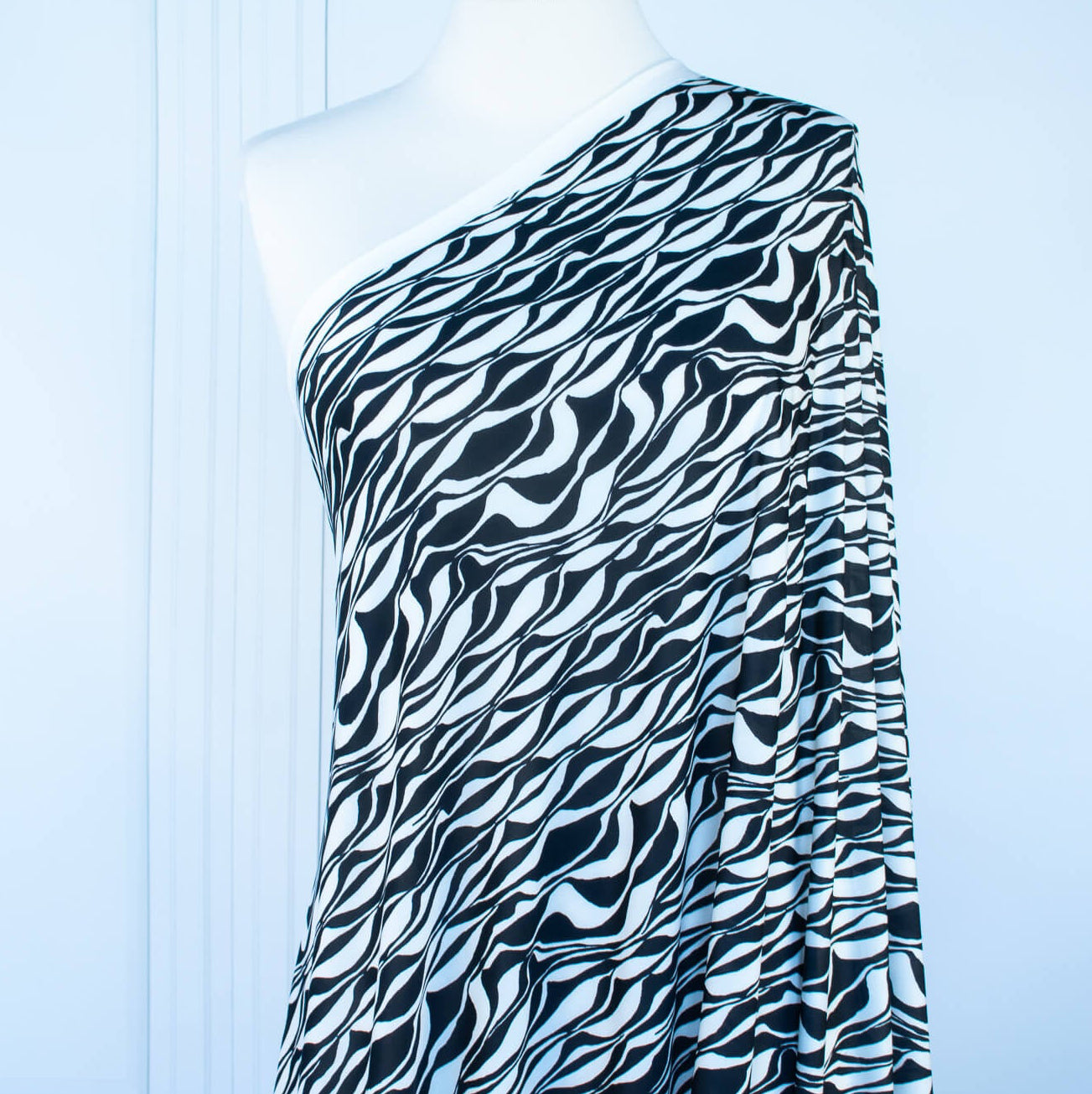 Image on dressform of  Black and Ivory Italian ITY jersey knit fabric by the yard 
