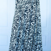 Image on dressform of  Black and Ivory Italian ITY jersey knit fabric by the yard. 