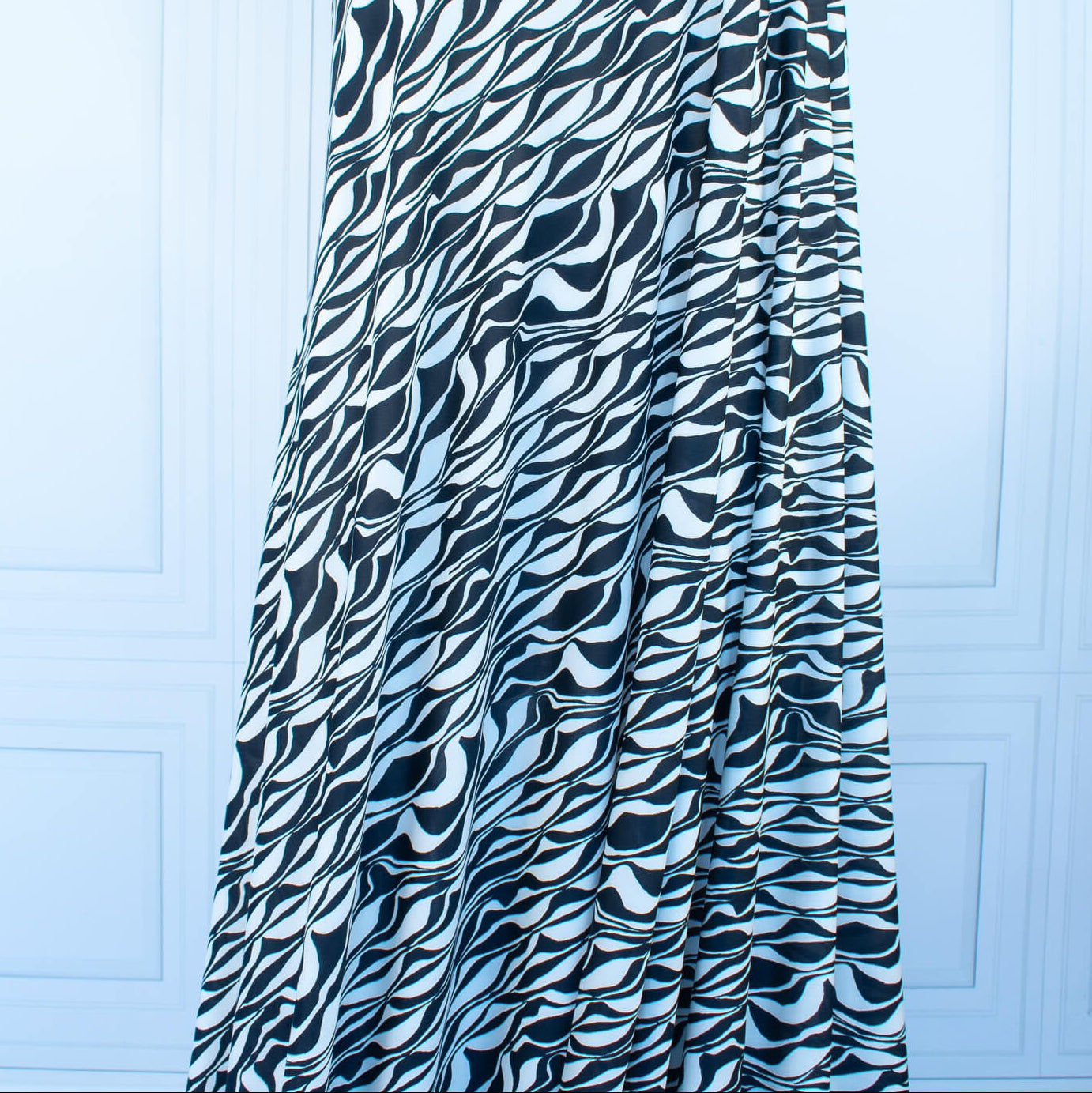 Image on dressform of  Black and Ivory Italian ITY jersey knit fabric by the yard. 