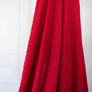 Italian Couture Red Melange YS1 Designer Boucle Virgin Wool fabric by the yard. Discreet luxury at its finest, this beautiful woolen boucle from an exclusive design house is the epitome of French elegance. Image of fabric drape.