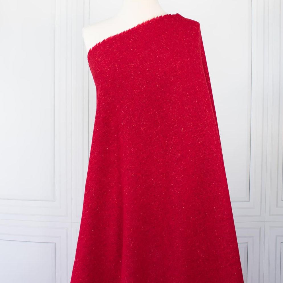 Italian Couture Red Melange YS1 Designer Boucle Virgin Wool fabric by the yard. Discreet luxury at its finest, this beautiful woolen boucle from an exclusive design house is the epitome of French elegance. Image of fabric on dressform.