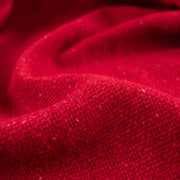 Italian Couture Red Melange YS1 Designer Boucle Virgin Wool fabric by the yard. Discreet luxury at its finest, this beautiful woolen boucle from an exclusive design house is the epitome of French elegance. Close up image.