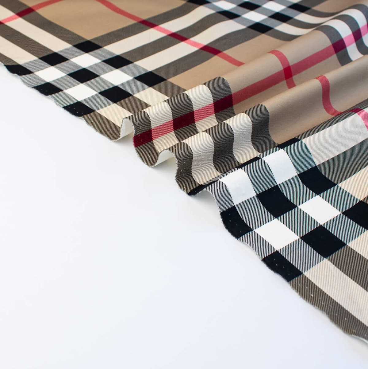 Couture British Designer Plaid Scuba Knit designer deadstock fabric by the yard. Bring on that London Style, in a classic plaid with a bit of a twist...it's scuba! Image of selvedge.