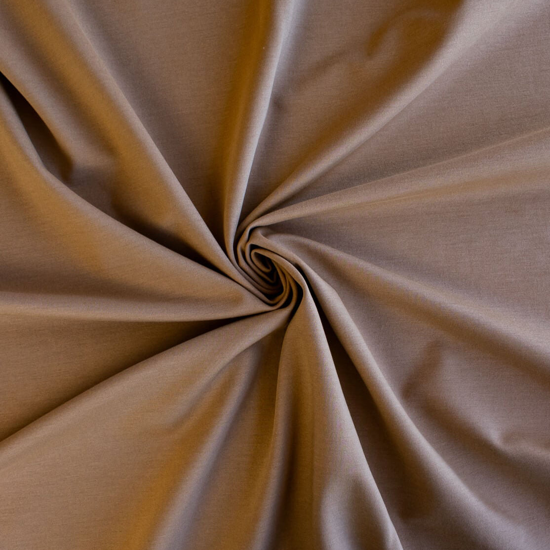 Close up  of High End British Designer Ponte De Milano  fabric in a classic tan color