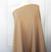 Image on dressform of High End British Designer Ponte De Milano  fabric in a classic tan color