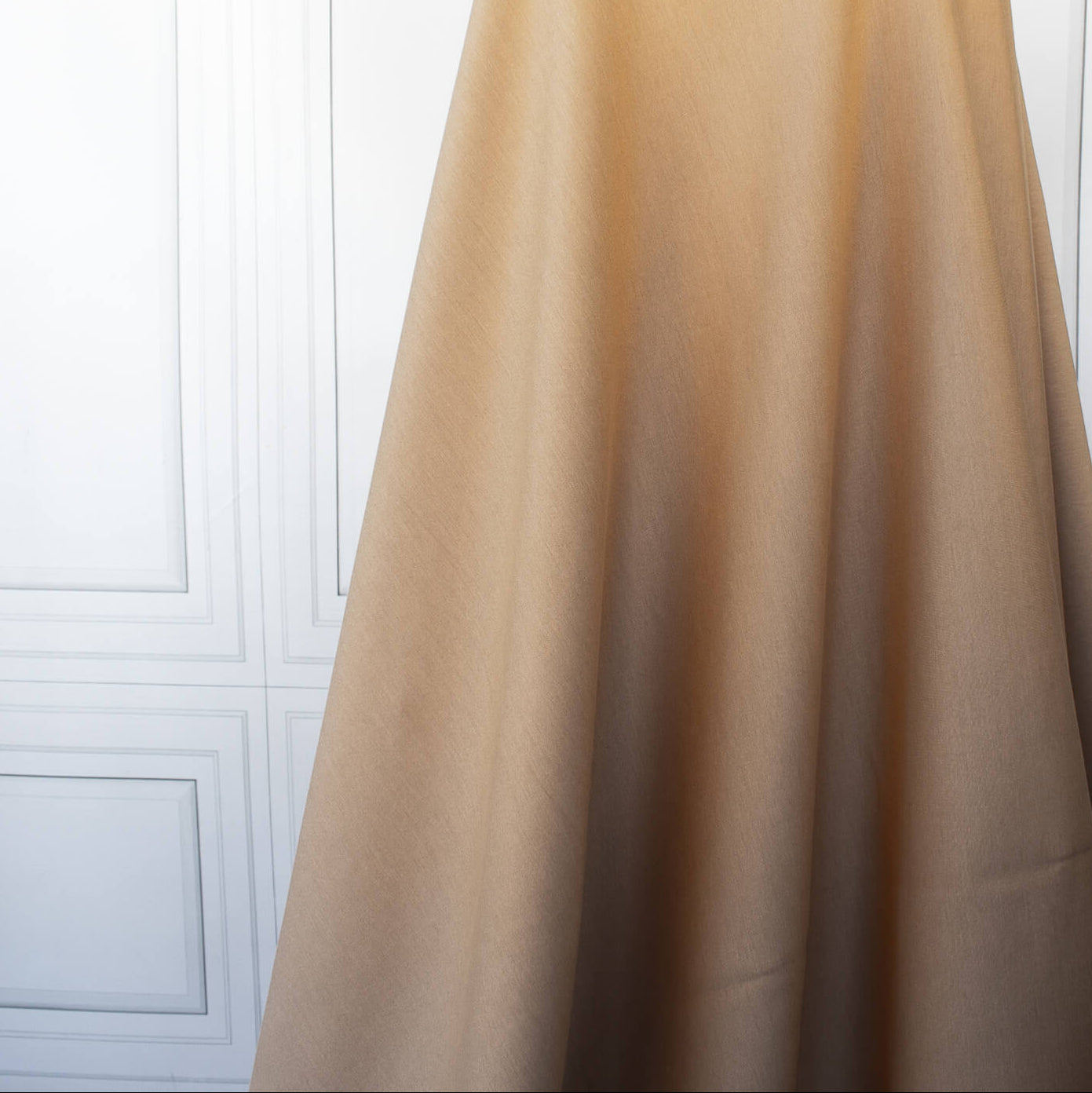 Image on dressform of High End British Designer Ponte De Milano  fabric in a classic tan color. 