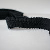 This classic Black Wool Blend Fold-Over Knitted Trim is a timeless choice for couture designs, adding a sophisticated touch of designer embellishment. With its luxurious knitted texture and fold-over shape, this trim will make any look iconic.  Choose your look... this trim can be used flat, or fold-over, which is especially nice for double-sided fabrics! Close up photo.
