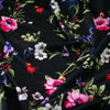 Create a look you’ll love in our timeless black DTY knit fabric with a floral print of pink, white, and purple flowers and soft green leaves. A gorgeous knit with a soft hand and fluid drape, perfect for making a garment that flatters!  Image of fabric pattern
