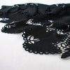 Image of: Sourced from a bridal and evening wear couture house comes this chic designer deadstock guipure lace fabric by the yard - a must have for any fashionista. The design showcases inky black maple leaves surrounded by eyelets and a double scalloped border, while the spaced thread bars (or brides) offer flexibility for incorporating the motif into your project.