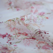 Floral Couture designer soft white silk chiffon fabric with pink flowers and green leaves 