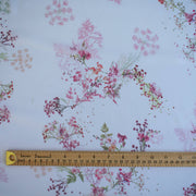 Floral Couture designer soft white silk chiffon fabric with pink flowers and green leaves with ruler for pattern scale