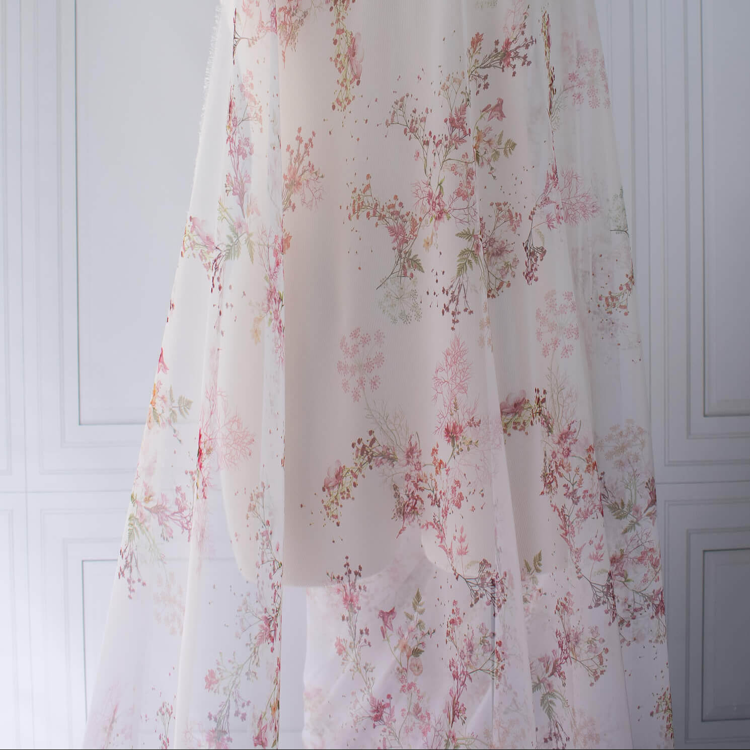 Floral Couture designer soft white silk chiffon fabric with pink flowers and green leaves draped on dressform