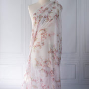 Floral Couture designer soft white silk chiffon fabric with pink flowers and green leaves draped on dressform
