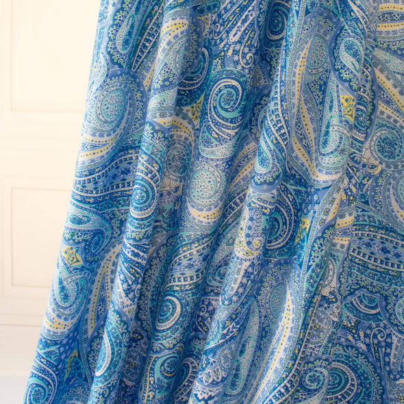 NY Designer Paisley Cotton Jersey fabric is made from 100% cotton for softness and breathability. A designer deadstock fabric that will keep you feeling comfortable and luxuriously stylish all day.  Image of fabric drape.
