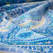 NY Designer Paisley Cotton Jersey fabric is made from 100% cotton for softness and breathability. A designer deadstock fabric that will keep you feeling comfortable and luxuriously stylish all day.  Close up photo.