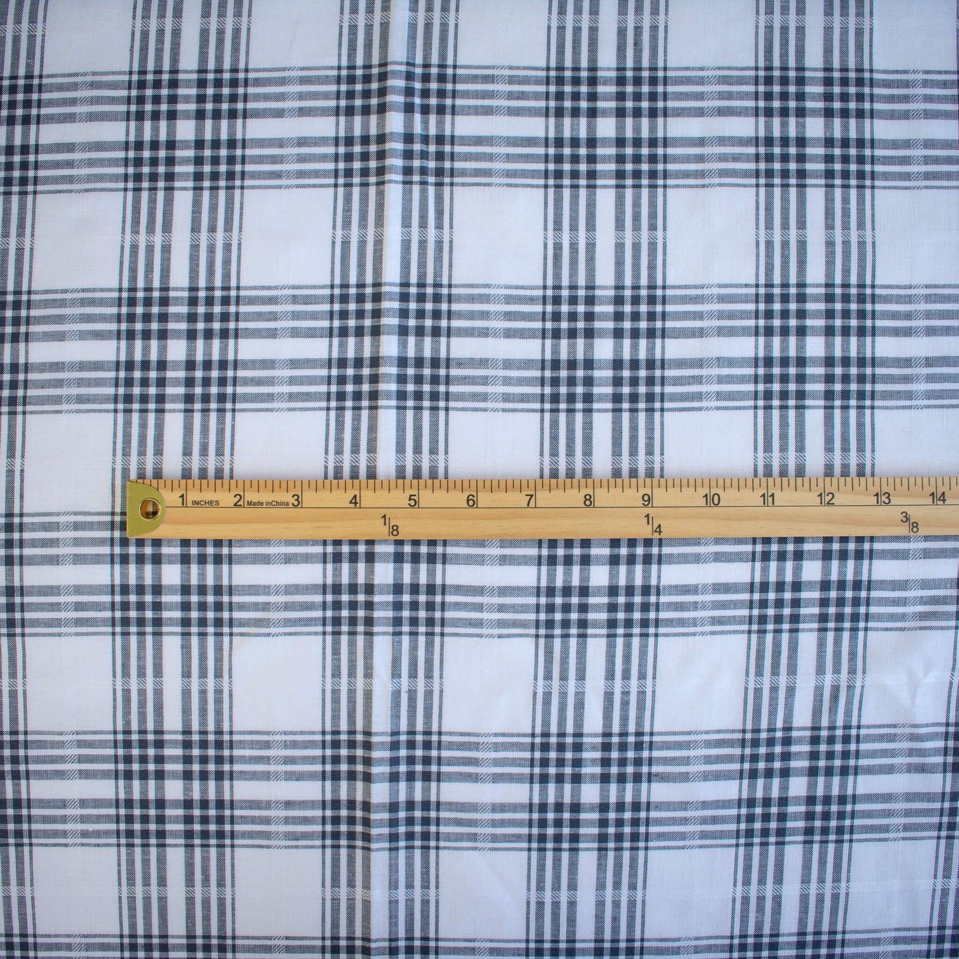 Designer Cotton Gauze Plaid fabric with a ruler showing pattern scale