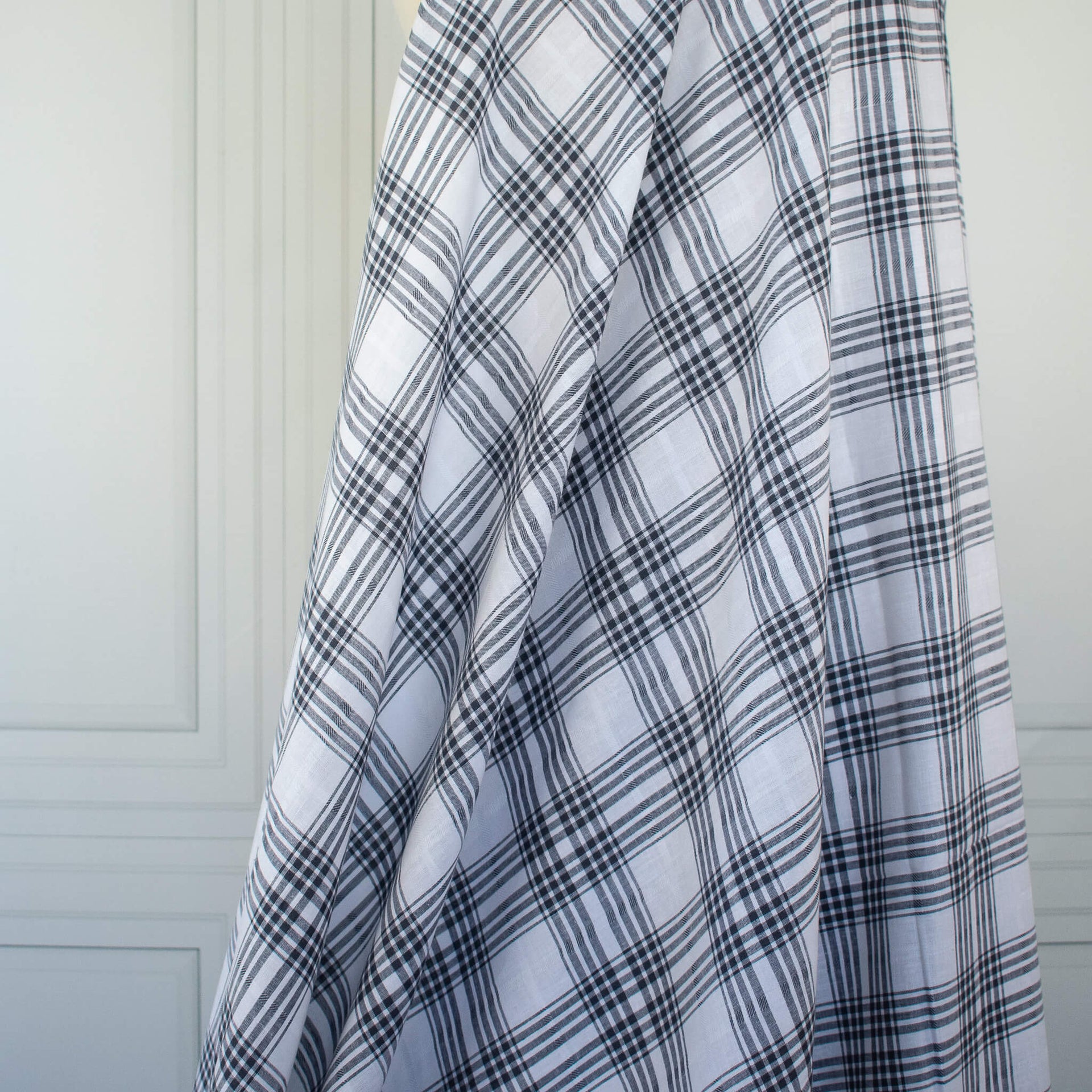 Designer blue and white cotton gauze fabric draped on dressform