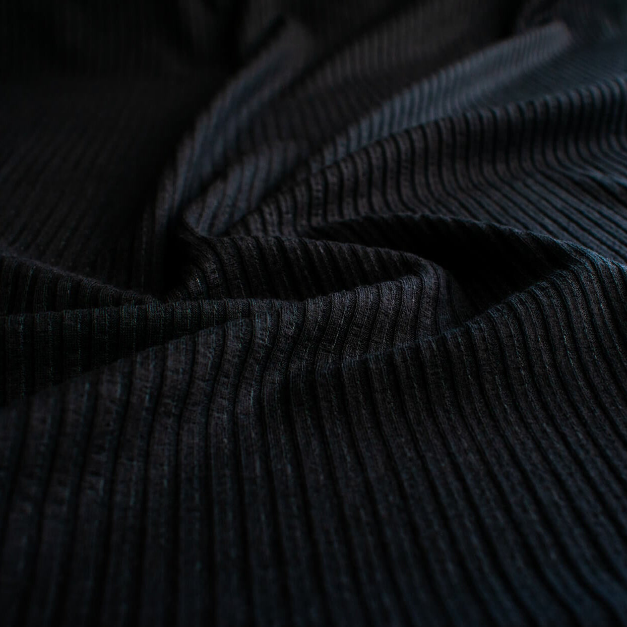 Close-up of NYC Designer Black Rayon Rib Knit fabric by the yard.