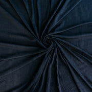 Image of NYC Designer Black Rayon Rib Knit fabric twirled to demonstrate fullness.
