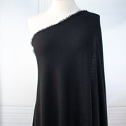 Image of NYC Designer Black Rayon Rib Knit fabric draped on dress form.