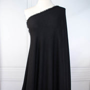 Image of NYC Designer Black Rayon Rib Knit fabric draped on dress form.