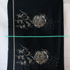 Los Angeles Designer Deadstock fabric Challis Panel. The fabric panel features a single large modern floral design and a border in ivory, amber and light grey against a black background. It is luxuriously soft and has a wonderful drape that will keep you comfortable in any season. Each panel measure approximately 28 inches in length by 58 inches wide. Image of fabric panel delineation.