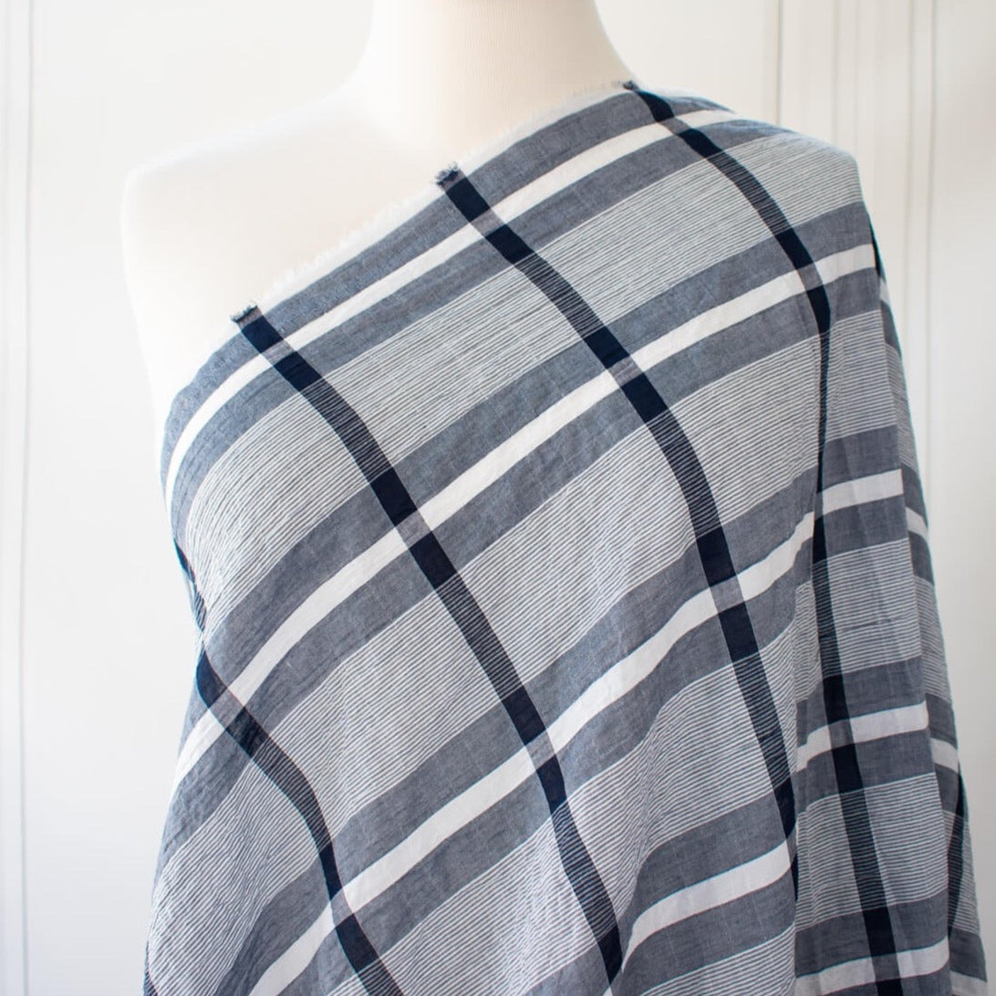 modern, navy blue and white plaid high-end designer cotton fabric. Photo of fabric on dressform.