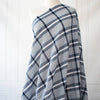 modern, navy blue and white plaid high-end designer cotton fabric. Photo of fabric on dressform.