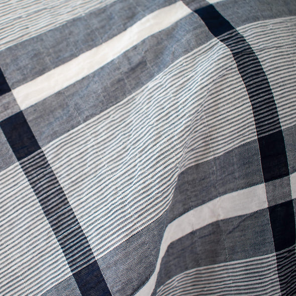modern, navy blue and white plaid high-end designer cotton fabric. Close up photo.