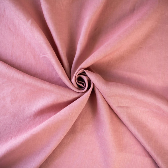 Enjoy the comfortable and luxurious feel of this designer 100% Linen fabric by the yard. This fine fabric features a classy soft rose color and is sure to inspire your 'Me Made' projects.  Image of fabric body.