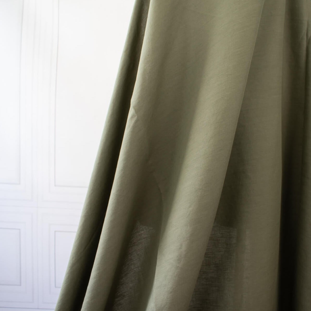 Enjoy the softness and breathability of linen, the drape of viscose and a bit of spandex stretch, all wrapped into one!   This designer deadstock fabric is from a contemporary luxe label and has a lovely sheen. The stretch is slight along the crosswise grain. Photo of fabric drape.