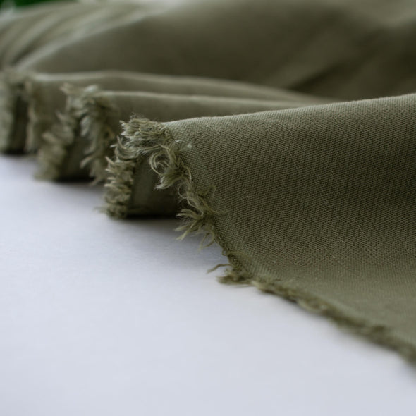 Enjoy the softness and breathability of linen, the drape of viscose and a bit of spandex stretch, all wrapped into one!   This designer deadstock fabric is from a contemporary luxe label and has a lovely sheen. The stretch is slight along the crosswise grain. Photo of fabric selvedge.