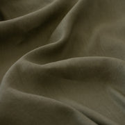 Enjoy the softness and breathability of linen, the drape of viscose and a bit of spandex stretch, all wrapped into one!   This designer deadstock fabric is from a contemporary luxe label and has a lovely sheen. The stretch is slight along the crosswise grain. Close up photo.