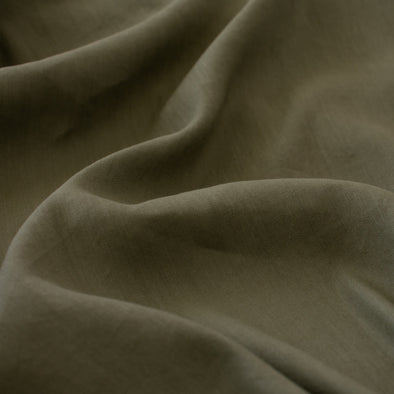 Enjoy the softness and breathability of linen, the drape of viscose and a bit of spandex stretch, all wrapped into one!   This designer deadstock fabric is from a contemporary luxe label and has a lovely sheen. The stretch is slight along the crosswise grain. Close up photo.