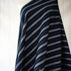 Deveaux France luxury yarn-dyed woven striped fabric featuring a crepe like texture and soft drape. Image of Navy fabric with white and cobalt blue vertical on dressform