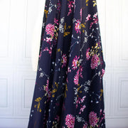 Imagae of Italian Navy Floral Viscose Crepe fabric draped on dressform