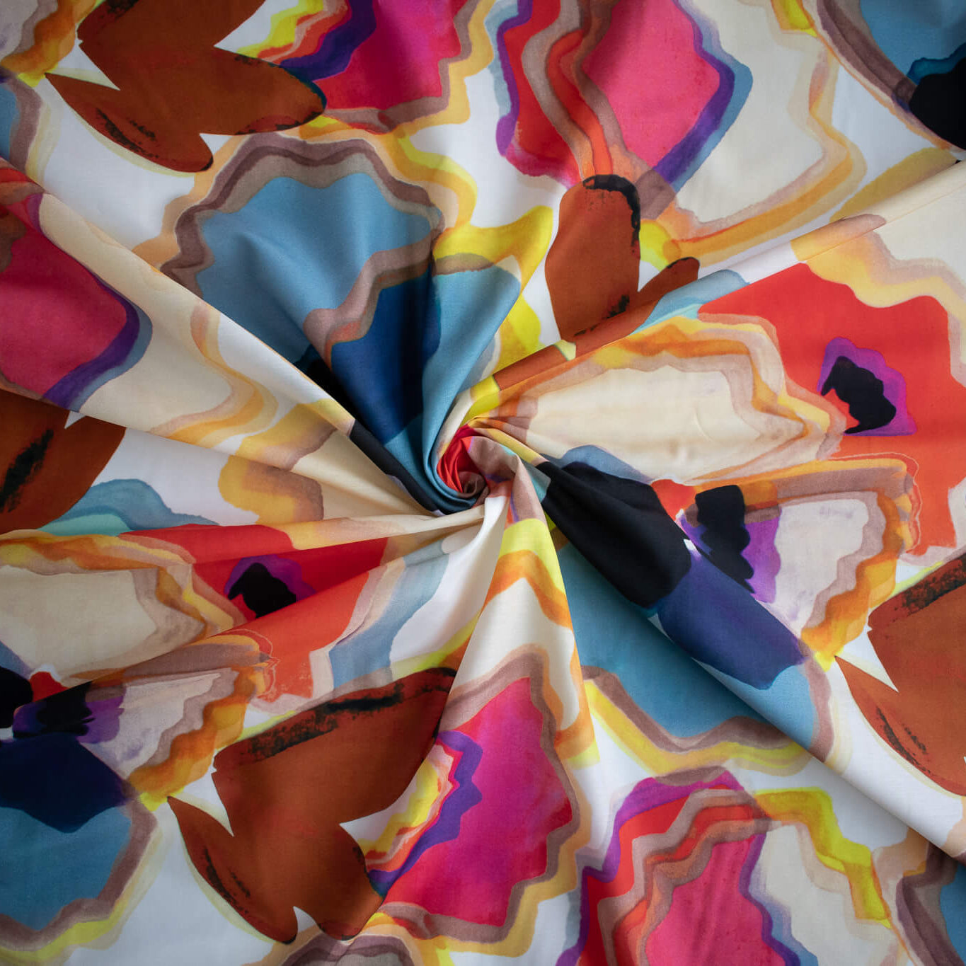 Image of High End Designer Modern Abstract Italian Cotton Silk Lawn fabric twirled to demonstrate fullness.