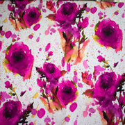 Image of designer Italian satin viscose woven fabric pattern design. Featuring an exquisite watercolor floral pattern of dark pink abstract roses against a soft white background.