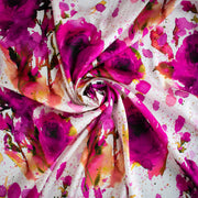 Image of designer Italian satin viscose woven fabric twirled to demonstrate fullness. 